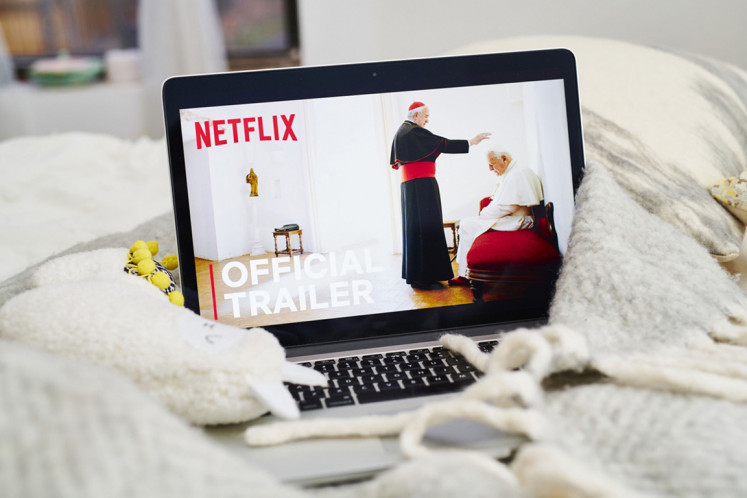 The home screen for the Netflix Inc. original movie Two Popes pictured in this undated photo.
