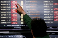 Taiwan to ease virus border controls to let in some business people