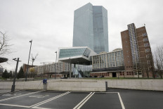 The European Central Bank (ECB) headquarters stands near electric vehicle charging spaces in a parking lot in Frankfurt, Germany, on Thursday, March 12, 2020. Christine Lagarde will bid to prevent the coronavirus outbreak from sparking a repeat of the 2008 financial turmoil when the European Central Bank finally unveils its monetary response to protect the region’s economy. Photographer: