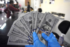 Dollar firm but stocks, oil under pressure as US-China tensions rise