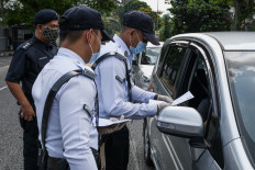 Malaysia steps up coronavirus tests as it braces for 'worst scenario'