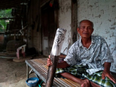 Some Indonesians try to ward off COVID-19 with talismans, rituals