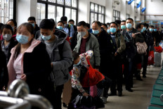 Lockdown lifted, but exodus from Chinese city hindered by new coronavirus test rule
