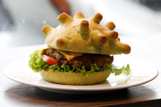 Eat it: Hanoi chef spreads joy with 'Coronaburger'