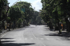 Bali orders people to stay at home on major holiday to contain COVID-19