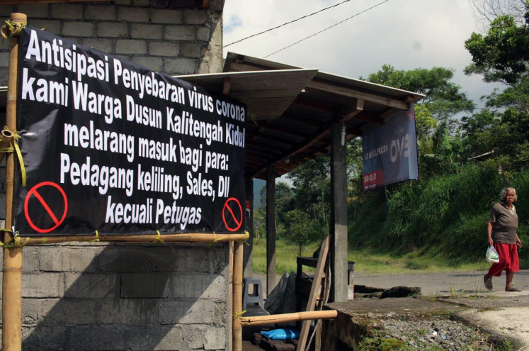 Residents of Kali Tengah hamlet in Sleman regency, Yogyakarta, also closed off roads leading to their neighborhood on Saturday, March 28, 2020.