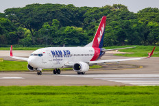 Nam Air B737-500 taxis before take-off at Soekarno-Hatta International Airport in Tangerang, Banten.