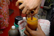 Handayani offers various kinds of jamu, from the sweet and sour kunyit asem to the bitter jamu paitan. JP/Rahmat Dian Prasanto
