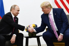 In this file photo US President Donald Trump  attends a meeting with Russia's President Vladimir Putin during the G20 summit in Osaka on June 28, 2019. President Donald Trump said Monday that he will shortly be talking with his Russian counterpart Vladimir Putin about plunging oil prices and the impact on US producers.