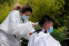 'This is bliss': Chinese barber has clients queuing up as Wuhan eases lockdown