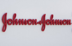  In this file photo taken on Aug. 28, 2019 an entry sign to the Johnson & Johnson campus shows their logo in Irvine, California. Johnson & Johnson said on Monday it had selected a lead candidate vaccine for the new coronavirus that would move to human trials by September and could be ready for emergency use by early next year. 