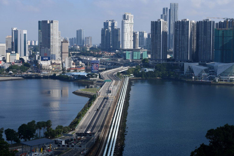 The causeway linking Malaysia's southern state of Johor (top) and Singapore (botom) is seen from Singapore on April 1, 2020.