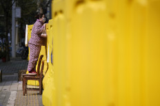 China reports 1,300 asymptomatic virus cases after public concern