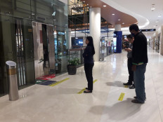 Business hit by COVID-19, Jakartans hope social restrictions can curb transmission