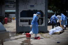 Ecuador stores coronavirus victims in giant fridges as morgues fill up