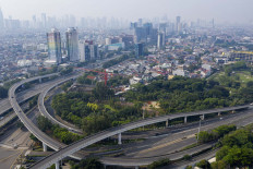 A birds-eye view shows empty roads in West Jakarta's Tomang district on Friday. The Jakarta administration has imposed a two-week period of large-scale social restrictions (PSBB).