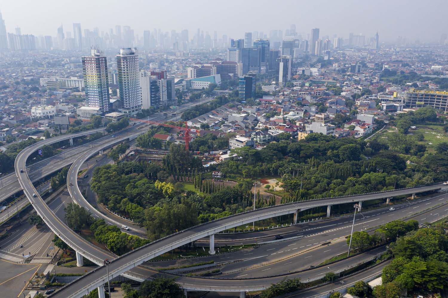 Uneasy calm descends on empty Jakarta as capital makes it through first ...