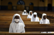 Nuns attend the Last Supper Mass in a nearly empty cathedral amid an outbreak of the coronavirus disease (COVID-19), in Ouagadougou, Burkina Faso on April 9, 2020. 