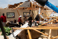 'Everything's gone': Tornadoes rip US South, kill at least 26