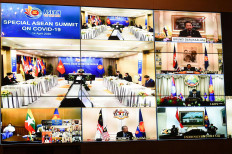 Leaders of the Association of Southeast Asian Nations (ASEAN) are seen on screen as they attend a special summit via video conference to discuss the the coronavirus disease (COVID-19) situation at the Government House in Bangkok, Thailand, April 14, 2020. 