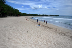 A general view shows a near-empty beach in Kuta on Indonesia's resort island of Bali on March 22, 2020, amid concerns of the COVID-19 coronavirus outbreak. 