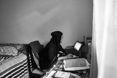 Hayatul joins an online class in her bedroom.  JP/Raudhatul Jumala
