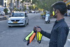 Millions back in confinement worldwide, India IT hub locks down