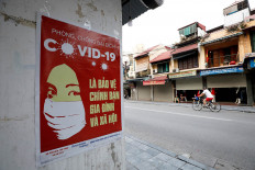 Vietnam relaxes virus restrictions as cases plateau