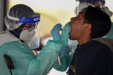 Nearly 100 Malaysians who recently returned from Indonesia test positive for COVID-19