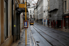 A tram is pictured at an empty street as the spread of the coronavirus disease (COVID-19) continues in downtown Lisbon, Portugal, on March 20, 2020. 