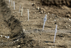 Hard-hit Milan buries unclaimed virus dead