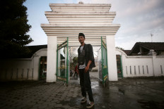 A worshipper stands in front of Pathok Negoro Mosque. JP/Boy T Harjanto