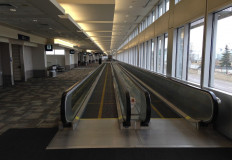 A moving walkway sits empty in Minneapolis–Saint Paul International Airport on April 20, 2020. 
