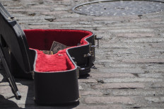 Stranded by coronavirus, a Russian family traveling in Indonesia busks to survive