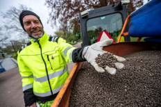 Garden worker Robert Nilsson shows chicken manure with which he fertilizes lawns in Stadsparken in an attempt to prevent residents from gathering for the traditional celebrations to mark the Walpurgis Night amid the spread of the coronavirus disease (COVID-19), in Lund, Sweden, on April 30, 2020.