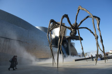 This picture shows French-American artist Louise Bourgeois' sculpture 'Maman' next to the Guggenheim Bilbao Museum in the Spanish Basque city of Bilbao, on February 7, 2020.  