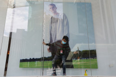 Migrant workers in Malaysia to undergo coronavirus tests as curbs eased