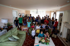 Victor Guzman and Melba Jimenez pose for a photograph with their 37 adopted children as they undergo self-quarantine together in their home during the coronavirus disease (COVID-19) outbreak, in San Jose, Costa Rica, on May 4, 2020. 