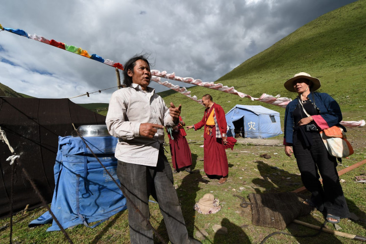 Let’s talk: Indonesian artist Arahmaiani (right) works with communities in the Tibet Plateau, China, a mountainous area sparsely populated by farmers and herdsmen.