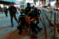 Riot police chase Hong Kong Mother's Day protesters