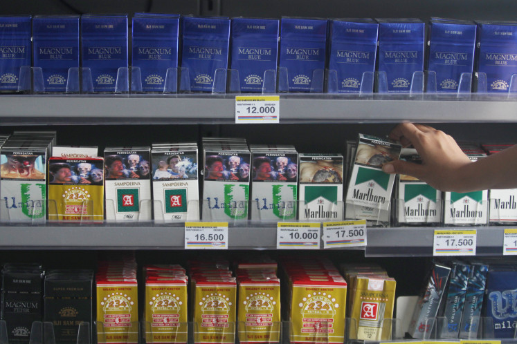 Big exposure: Cigarette packages are sold everywhere in Indonesia including at convenient stores where children can easily see them.