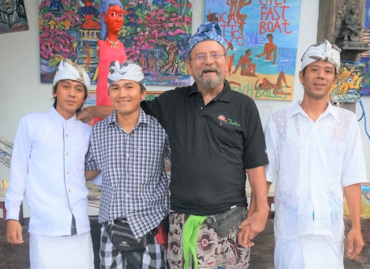 Family: Symon (second right) poses with his main crew at his Art Zoo studio in North Bali. The artist, who made Bali his home for over 40 years, passed away on April 15 of natural causes from sepsis.