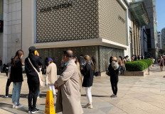 People queue to enter the Chanel boutique at a department store amid the coronavirus disease (COVID-19) outbreak, in Seoul, South Korea, on May 13, 2020. 