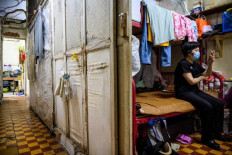 Self-distancing a pipe dream in Hong Kong's cramped 'cubicle flats'