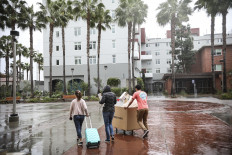 Students and their parents move their belongings from their dormitories at San Diego State University in San Diego, California, on March 18, 2020. 