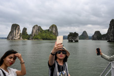 Tourists back in Vietnam's Ha Long Bay as domestic travel opens