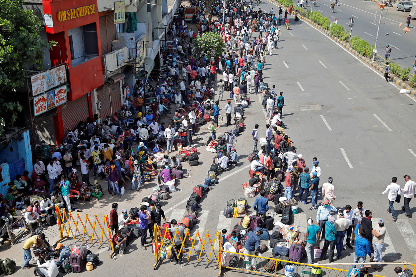 Migrant worker virus exodus plunges India's factories into crisis ...