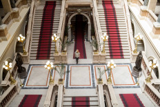 A woman, wearing a face mask, visits the National Museum on May 18, 2020 during the International Museum Day in Prague, amid the new coronavirus pandemic.

