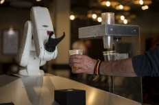 In Spain, bar bot serves up contact-free beers