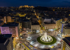 An aerial view shows the Athens' newly renovated Omonoia square as the Acropolis hill is illuminated in the background, in Athens, on May 21, 2020. 